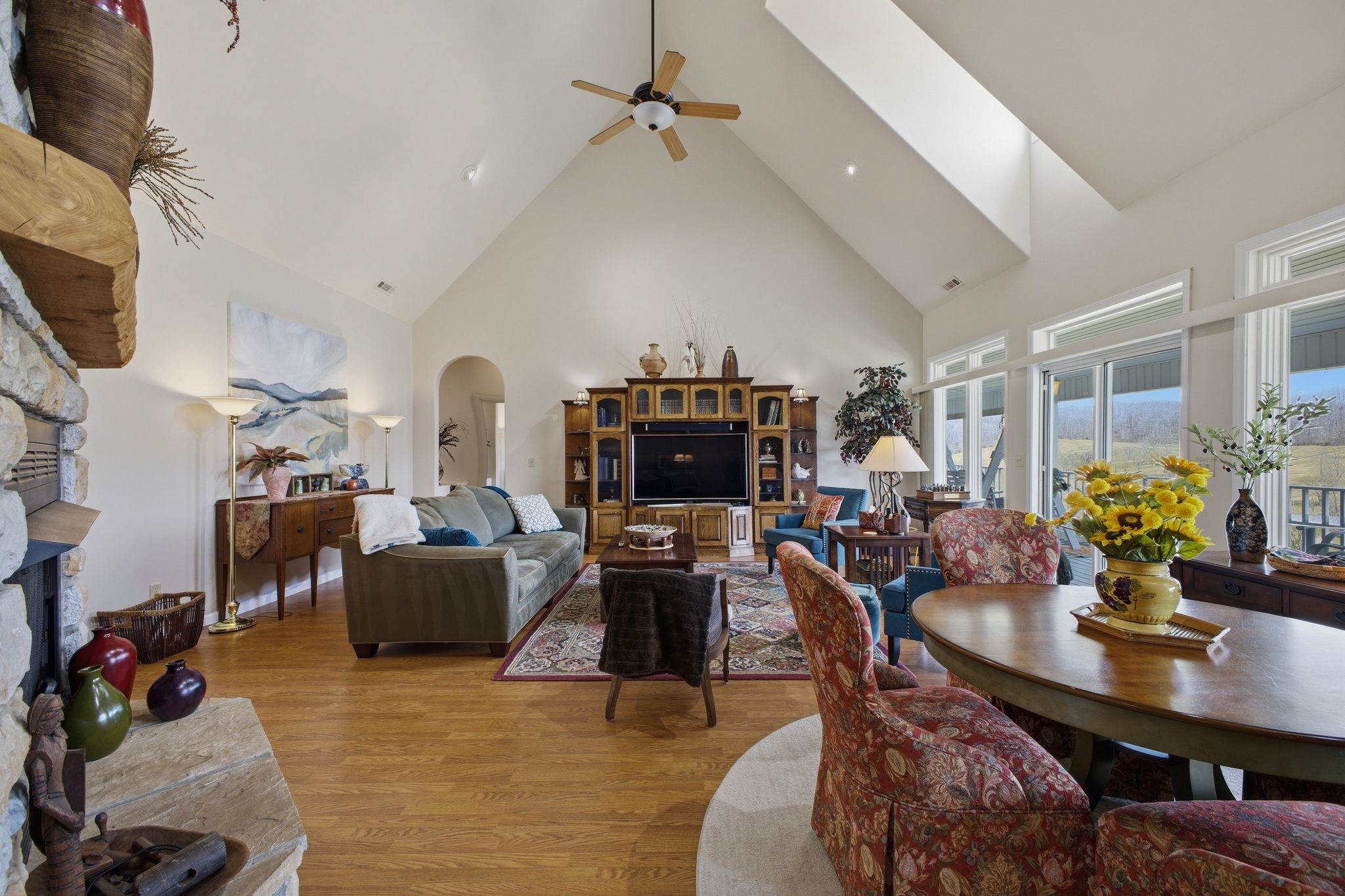 Great room with soaring ceilings and stone fireplace