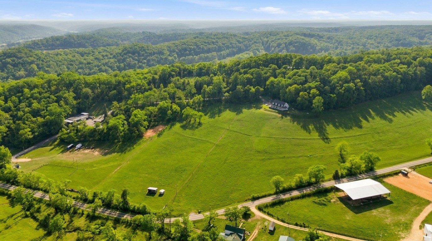 High aerial showing full property and road frontage