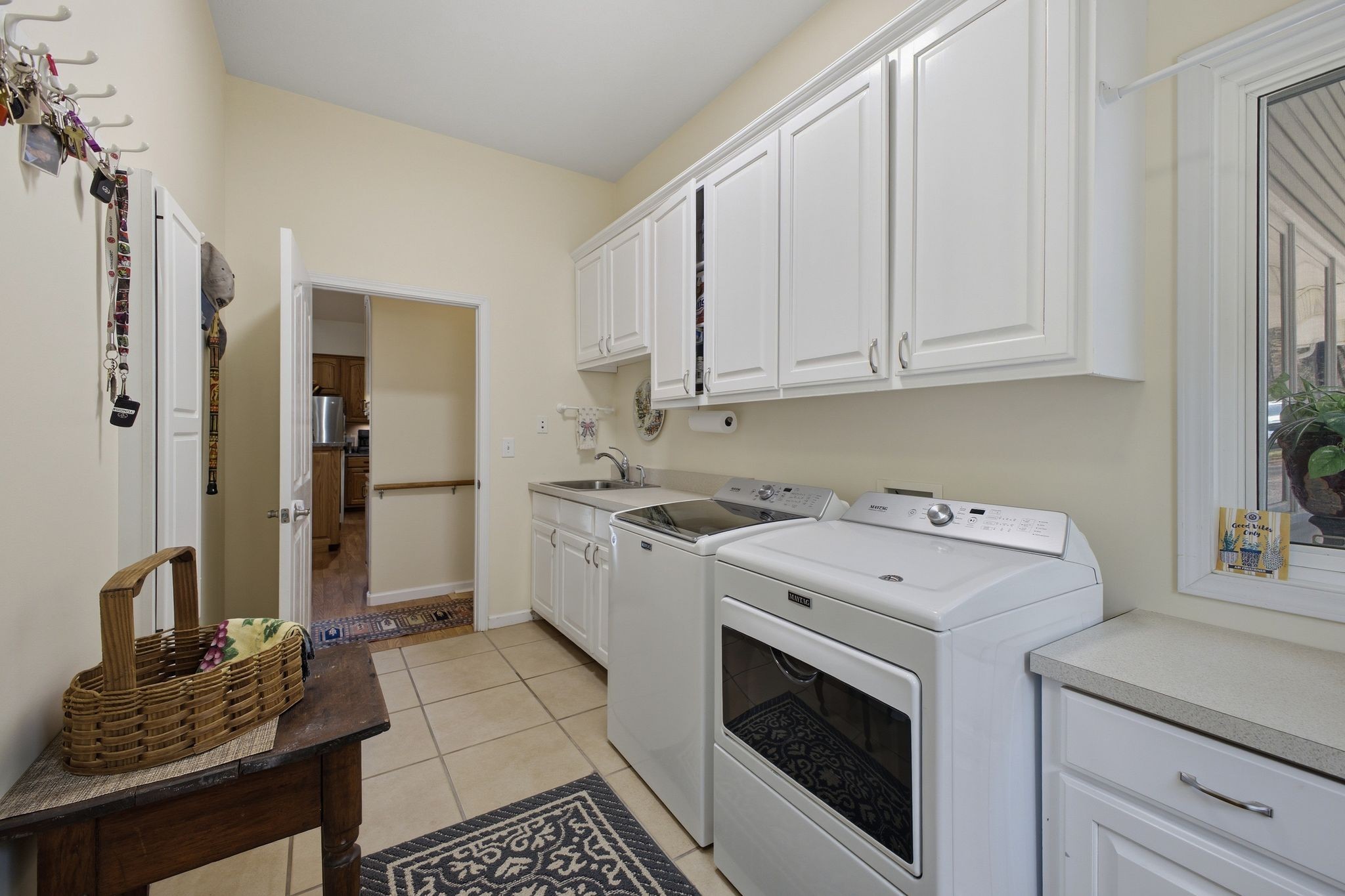 Oversized laundry room with utility sink